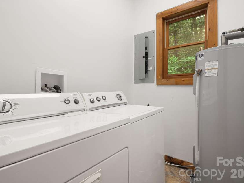 125 Hyacinth Drive, Clyde, NC 28721.  MLS# CAR4409445, YatesRealty ID 52893. Downstairs Laundry & Bathroom