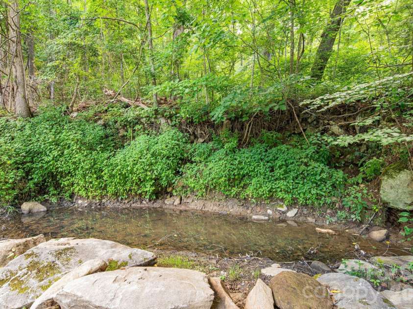 125 Hyacinth Drive, Clyde, NC 28721.  MLS# CAR4409445, YatesRealty ID 52893. Pond