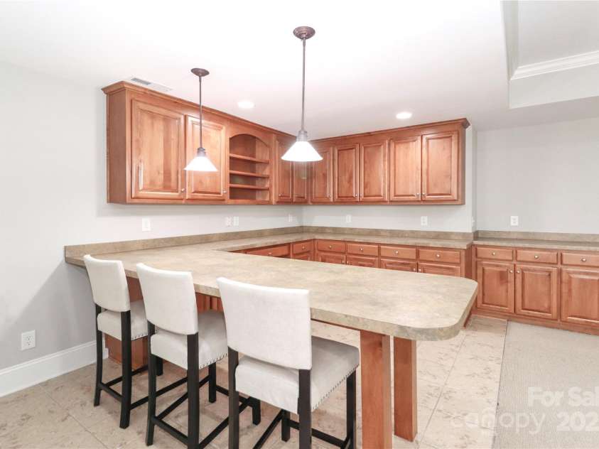188 Wild Harbor Road, Mooresville, NC 28117.  MLS# CAR4239589, YatesRealty ID 5291. Built-ins and bar space