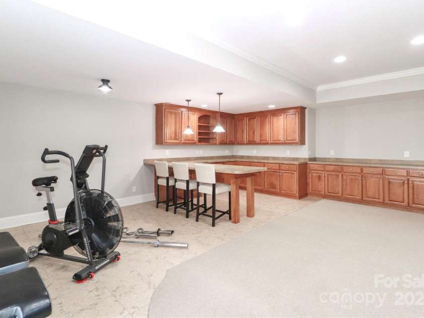188 Wild Harbor Road, Mooresville, NC 28117.  MLS# CAR4239589, YatesRealty ID 5291. Flex room used as game room and exercise space