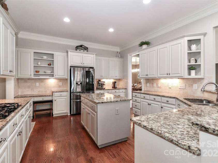 188 Wild Harbor Road, Mooresville, NC 28117.  MLS# CAR4239589, YatesRealty ID 5291. Kitchen with granite countertops and island