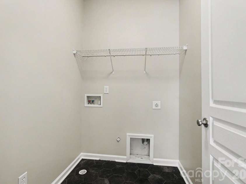 5955 Pale Moss Lane, Charlotte, NC 28269.  MLS# CAR4357485, YatesRealty ID 5291. Upper Floor Laundry Room