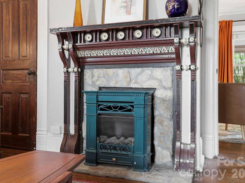 60 Roberts Street, Asheville, NC 28801.  MLS# CAR4427697, YatesRealty ID 52914. Original fireplace with working gas insert