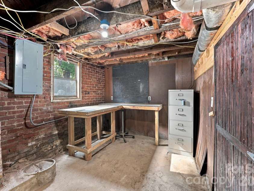 516 Englewood Street, Concord, NC 28025.  MLS# CAR4428466, YatesRealty ID 52921. Basement storage and workshop