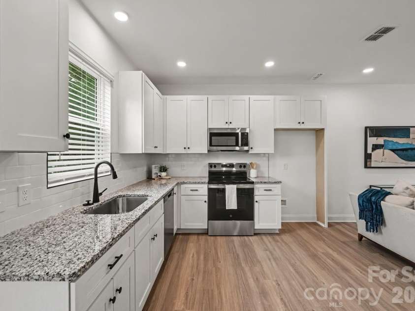 45 13th Street, Newton, NC 28658.  MLS# CAR4428128, YatesRealty ID 52922. Stainless appliances complete the kitchen.