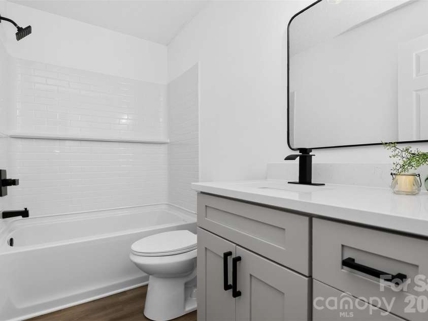 521 Katonah Avenue, Charlotte, NC 28208.  MLS# CAR4427639, YatesRealty ID 52933. Primary en-suite Bath with soft close cabinets on the vanity