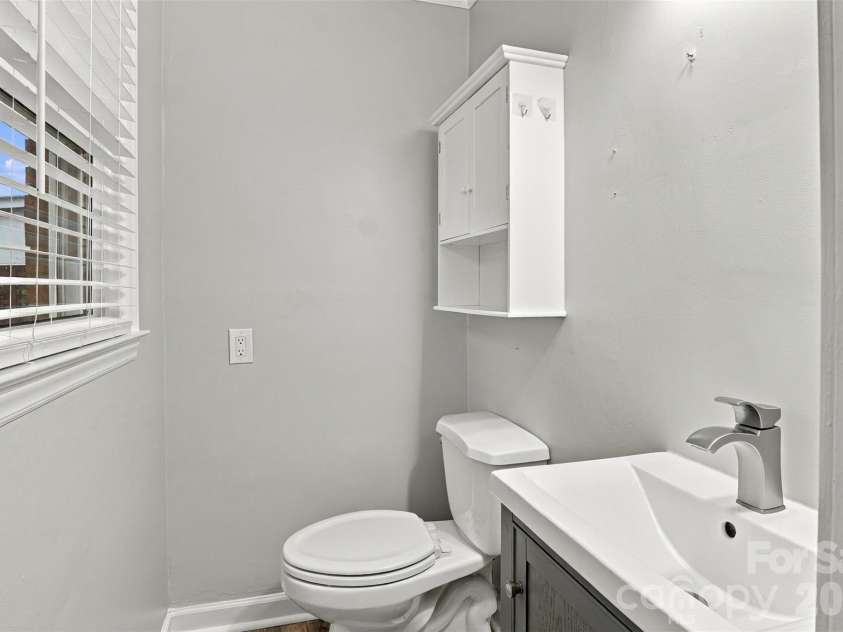 7033 Starvalley Drive, Charlotte, NC 28210.  MLS# CAR4427394, YatesRealty ID 52938. Main Bedroom half bathroom, updated