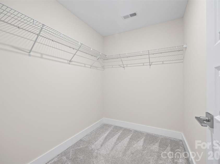 1229 Lomax Avenue, Charlotte, NC 28211.  MLS# CAR4427247, YatesRealty ID 52943. 3rd FL: Bedroom walk-in closet with ample hanging space