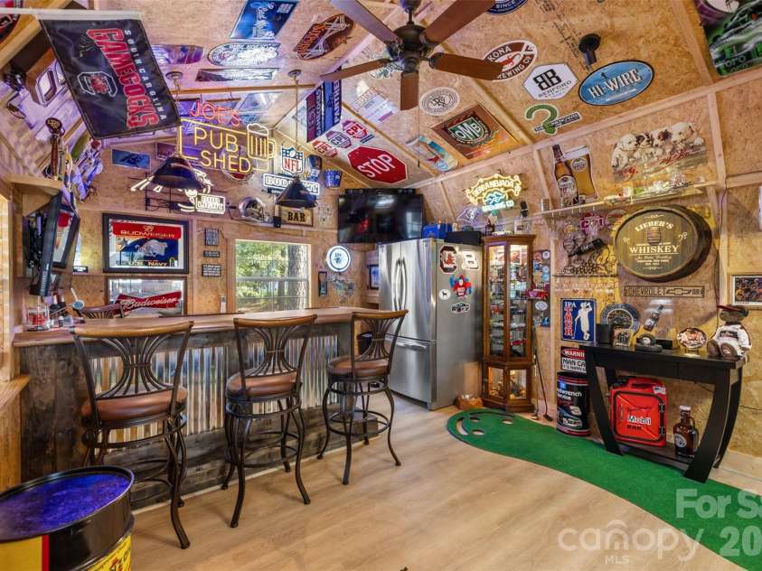1604 Aragon Beach Road, Rock Hill, SC 29732.  MLS# CAR4427159, YatesRealty ID 52944. Custom backyard pub complete with bar seating, beverage storage, and mini-split HVAC