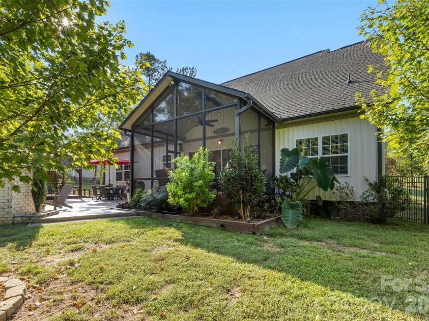 1604 Aragon Beach Road, Rock Hill, SC 29732.  MLS# CAR4427159, YatesRealty ID 52944. Private backyard setting overlooking woods and mature landscaping with irrigation