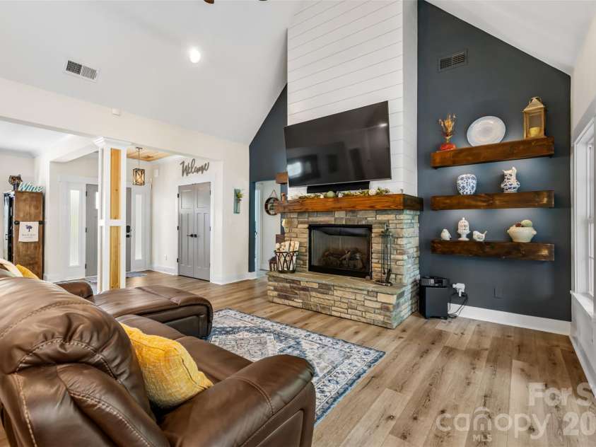 1604 Aragon Beach Road, Rock Hill, SC 29732.  MLS# CAR4427159, YatesRealty ID 52944. Soaring ceilings and a beautiful stone fireplace create a cozy focal point