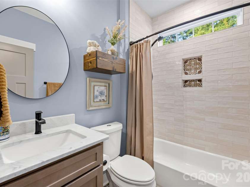 1604 Aragon Beach Road, Rock Hill, SC 29732.  MLS# CAR4427159, YatesRealty ID 52944. Stylish secondary bath with floor-to-ceiling shower tile
