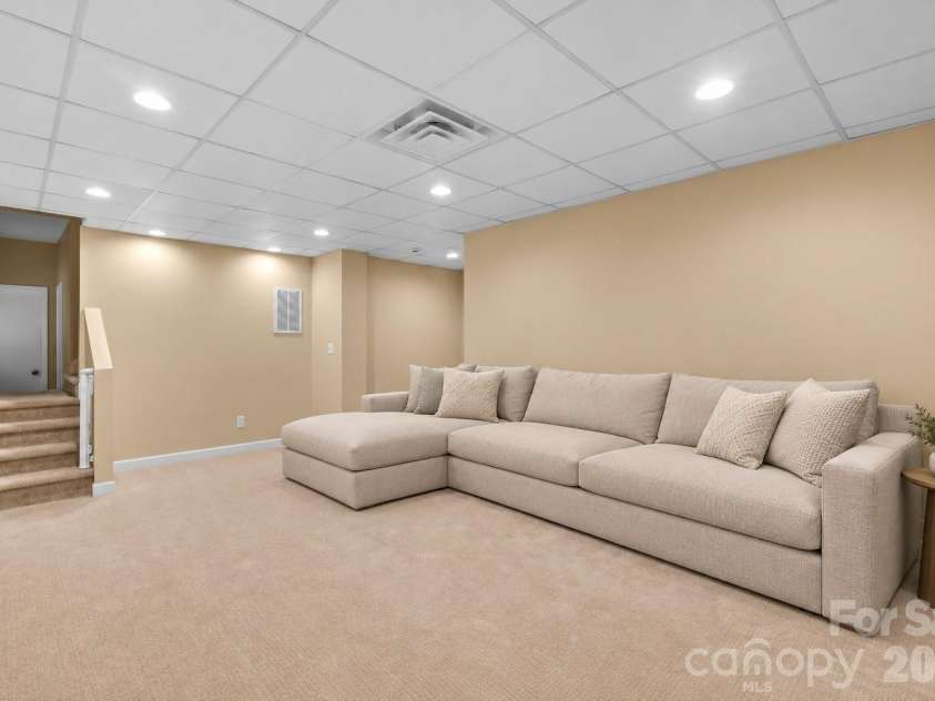 6623 Brookcrest Drive, Charlotte, NC 28210.  MLS# CAR4426988, YatesRealty ID 52948. Virtually staged basment living area