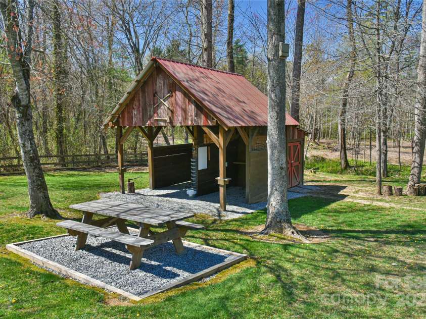 79 Pattys Chapel Road, Fletcher, NC 28732.  MLS# CAR4239671, YatesRealty ID 5295. Accessory building with attached shed. Currently an axe-throwing / target pavilion.
