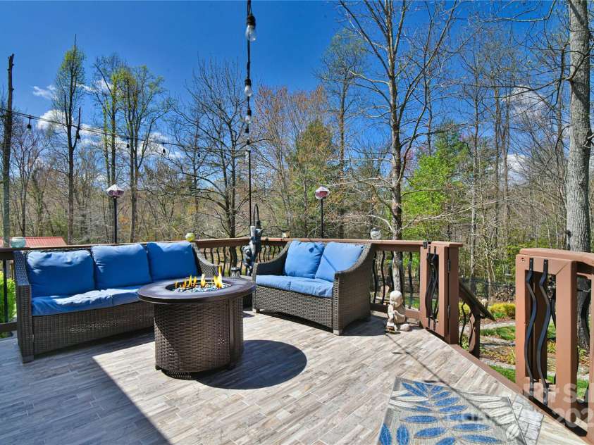 79 Pattys Chapel Road, Fletcher, NC 28732.  MLS# CAR4239671, YatesRealty ID 5295. Additional conversation area on the rear deck.