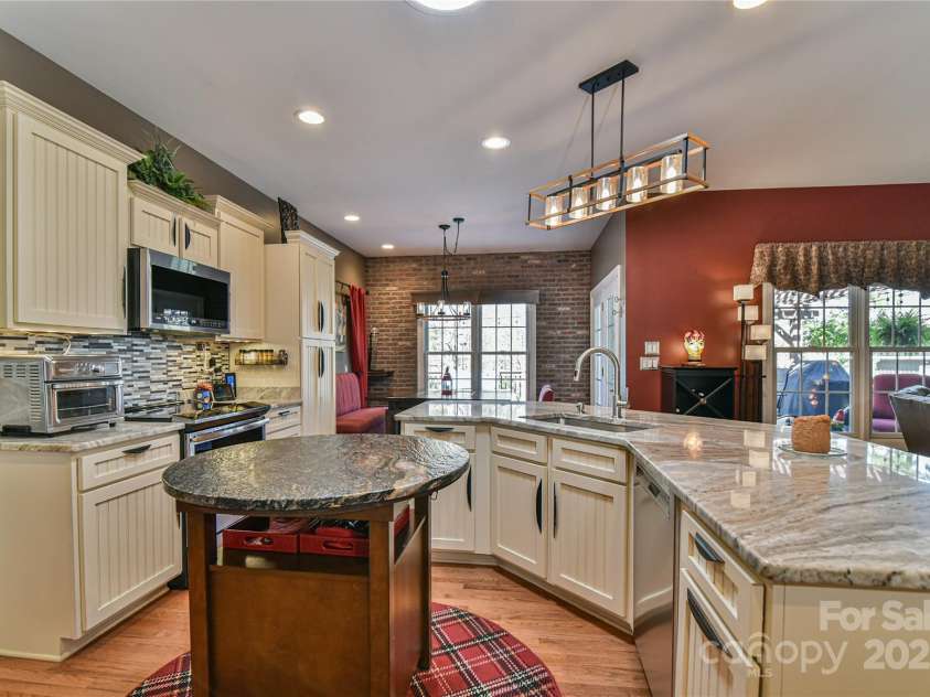 79 Pattys Chapel Road, Fletcher, NC 28732.  MLS# CAR4239671, YatesRealty ID 5295. Alternate view of kitchen and dining area