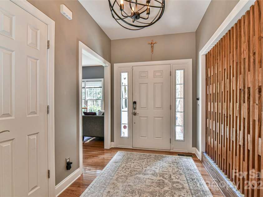 79 Pattys Chapel Road, Fletcher, NC 28732.  MLS# CAR4239671, YatesRealty ID 5295. Foyer - office/flex room is on the left, dining room is on the right.