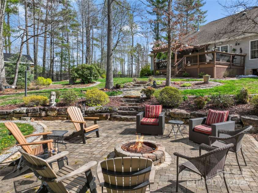 79 Pattys Chapel Road, Fletcher, NC 28732.  MLS# CAR4239671, YatesRealty ID 5295. Large level firepit area sets the tone for memories.