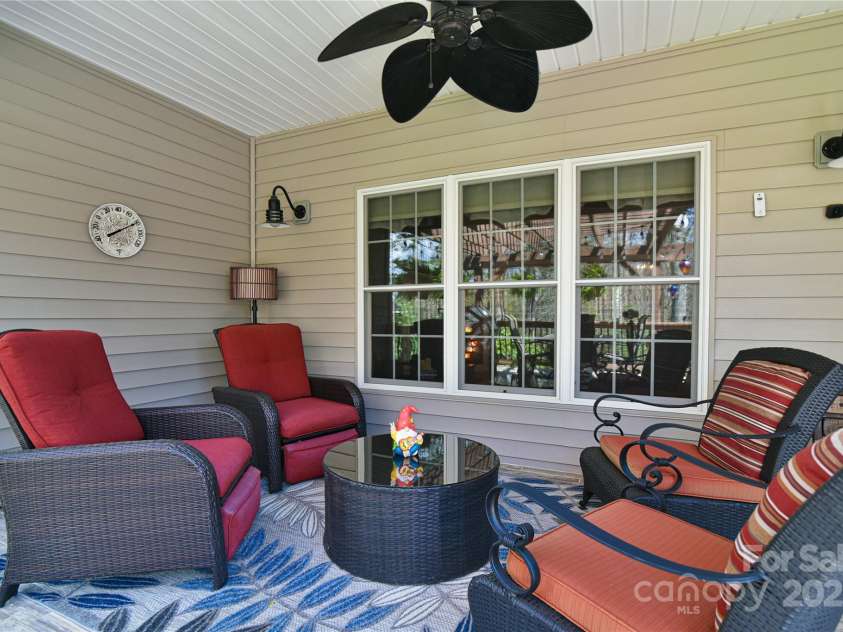 79 Pattys Chapel Road, Fletcher, NC 28732.  MLS# CAR4239671, YatesRealty ID 5295. Outdoor conversation area under roof