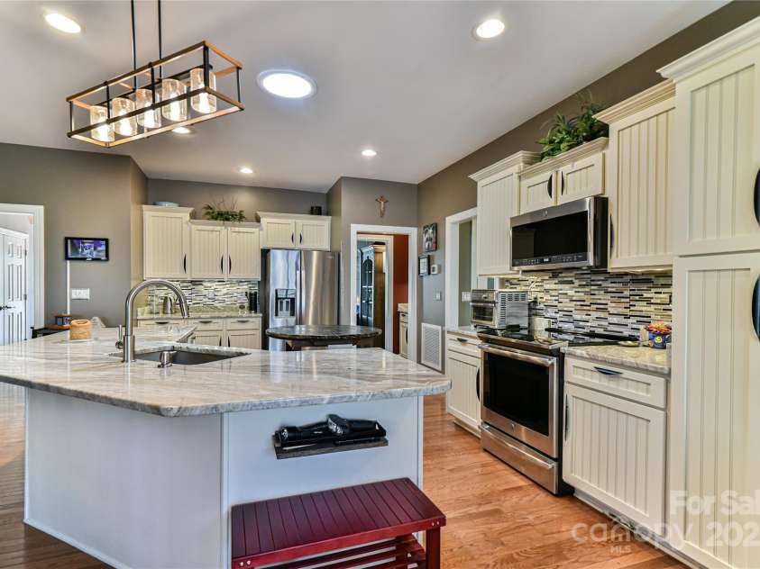 79 Pattys Chapel Road, Fletcher, NC 28732.  MLS# CAR4239671, YatesRealty ID 5295. View of kitchen from the dining nook