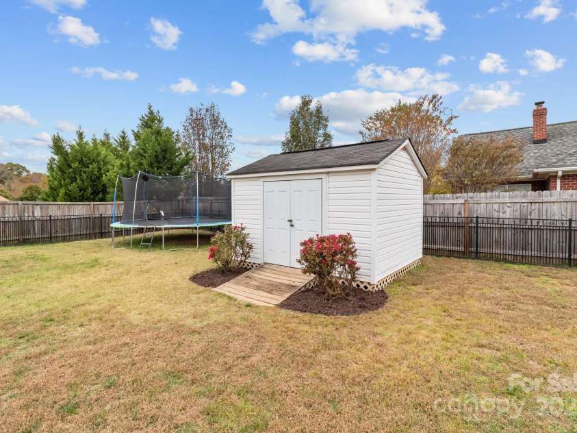 3419 Brickyard Lane, Midland, NC 28107.  MLS# CAR4266112, YatesRealty ID 5296. Large fully fenced backyard with shed!