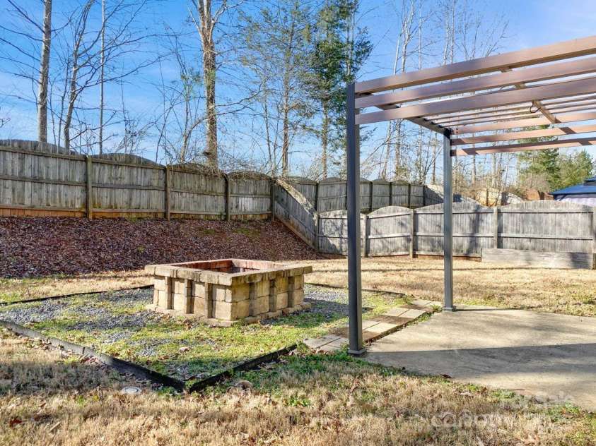 11627 Tribal Drive, Charlotte, NC 28214.  MLS# CAR4214830, YatesRealty ID 5297. Large backyard with pergola