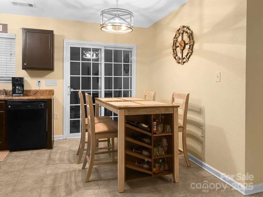 11627 Tribal Drive, Charlotte, NC 28214.  MLS# CAR4214830, YatesRealty ID 5297. Large kitchen with patio access