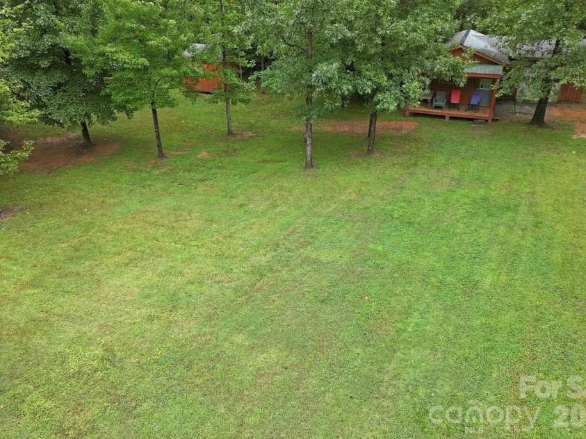 128 Maxamy Lane, Mooresville, NC 28117.  MLS# CAR4425165, YatesRealty ID 52979. Park-like backyard