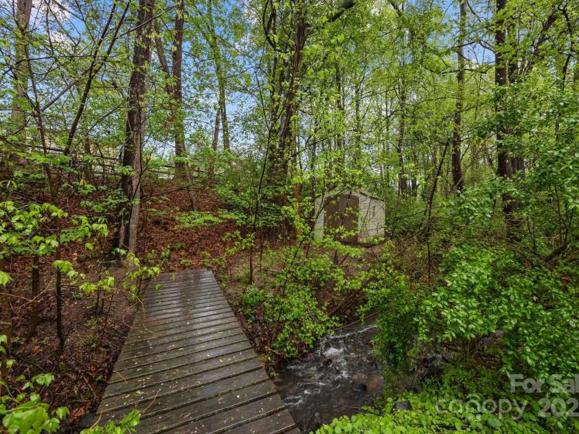 17301 Glassfield Drive, Huntersville, NC 28078.  MLS# CAR4241546, YatesRealty ID 5298. Bridge over creek and storage unit (conveys)!