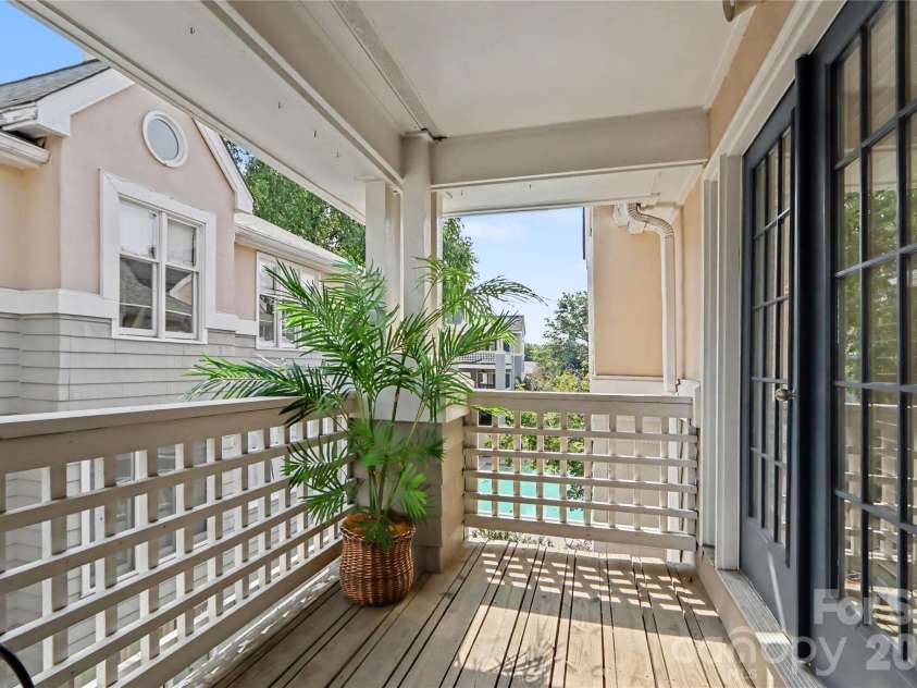 222 Queens Road, Charlotte, NC 28204.  MLS# CAR4422813, YatesRealty ID 52992. Balcony with pool view
