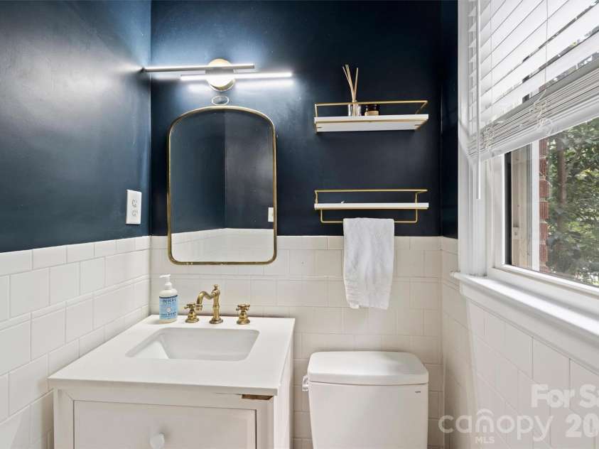 2816 Shamrock Drive, Charlotte, NC 28205.  MLS# CAR4422671, YatesRealty ID 52994. Half bath in main bedroom
