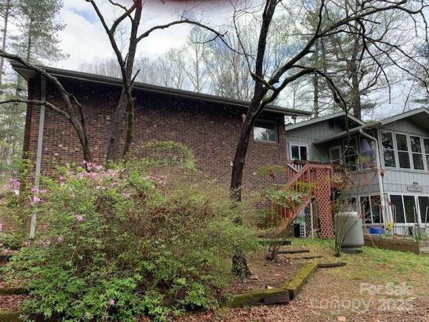 101 LAKEMONT Drive, Flat Rock, NC 28731.  MLS# CAR4246456, YatesRealty ID 53. Brick is garage, the other over looks org. gardens