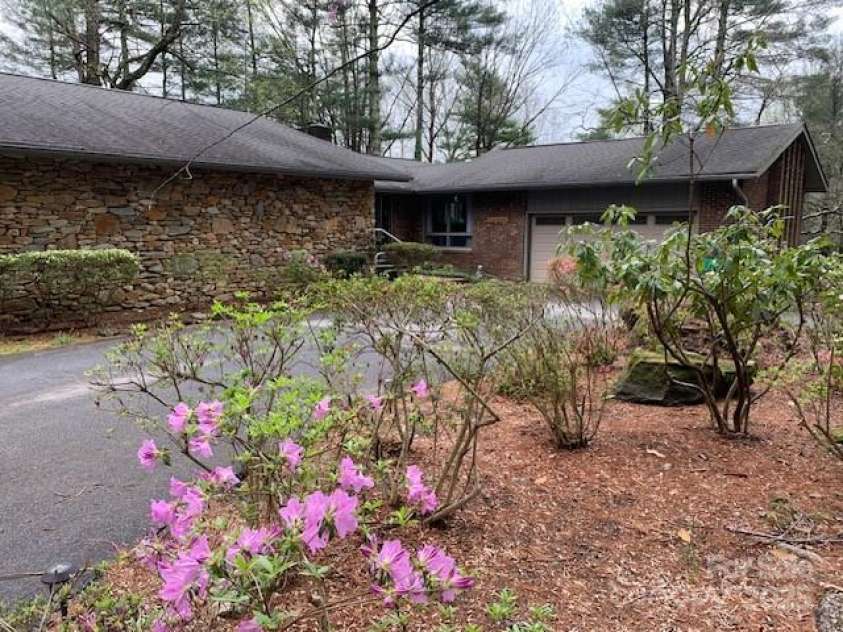 101 LAKEMONT Drive, Flat Rock, NC 28731.  MLS# CAR4246456, YatesRealty ID 53. From long private drive, circle drive by front door