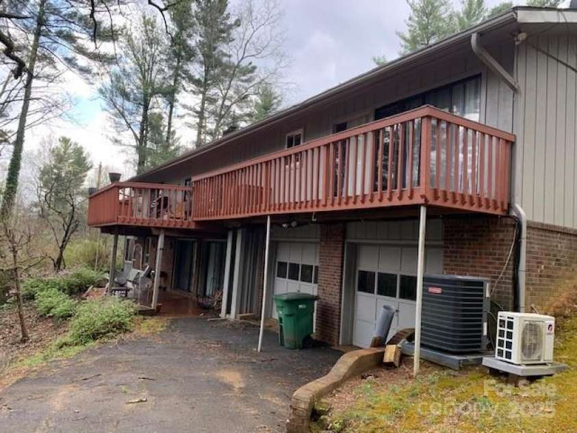 101 LAKEMONT Drive, Flat Rock, NC 28731.  MLS# CAR4246456, YatesRealty ID 53. Note the 2 car garage doors, goes to SHOP