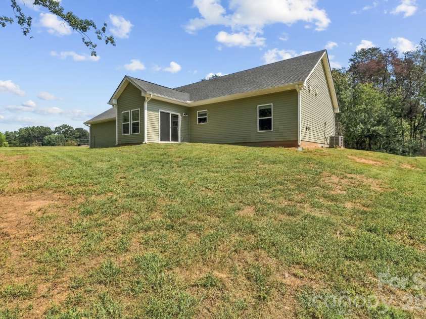 916 Westminster Drive, Statesville, NC 28677.  MLS# CAR4428276, YatesRealty ID 53016. Back corner looking toward home