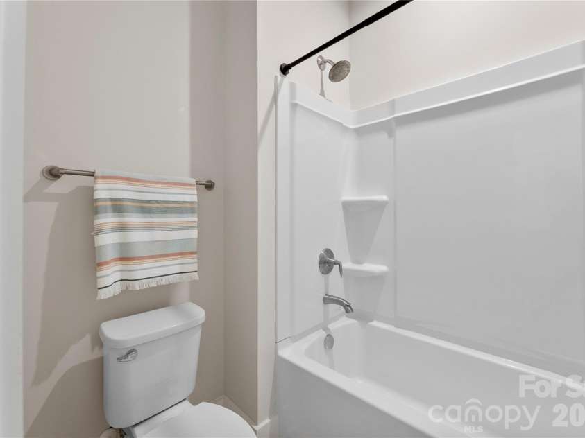9722 Munsing Drive, Charlotte, NC 28269.  MLS# CAR4427726, YatesRealty ID 53017. 2nd Floor Guest Bathroom