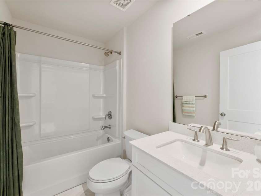 9722 Munsing Drive, Charlotte, NC 28269.  MLS# CAR4427726, YatesRealty ID 53017. 3rd Floor Bathroom