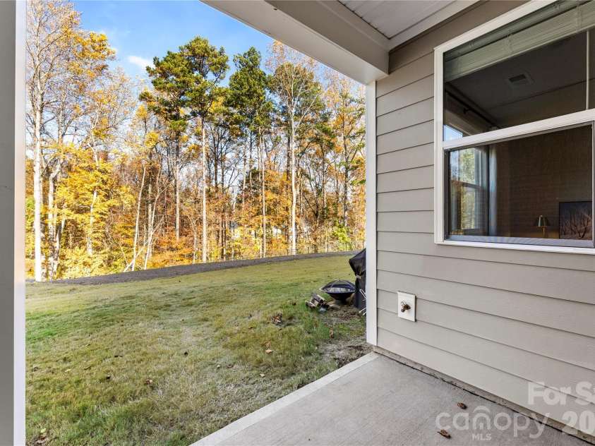9722 Munsing Drive, Charlotte, NC 28269.  MLS# CAR4427726, YatesRealty ID 53017. Covered Back Patio
