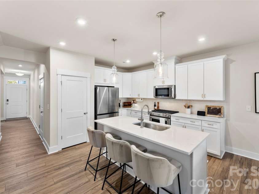 9722 Munsing Drive, Charlotte, NC 28269.  MLS# CAR4427726, YatesRealty ID 53017. Kitchen & Front Entry