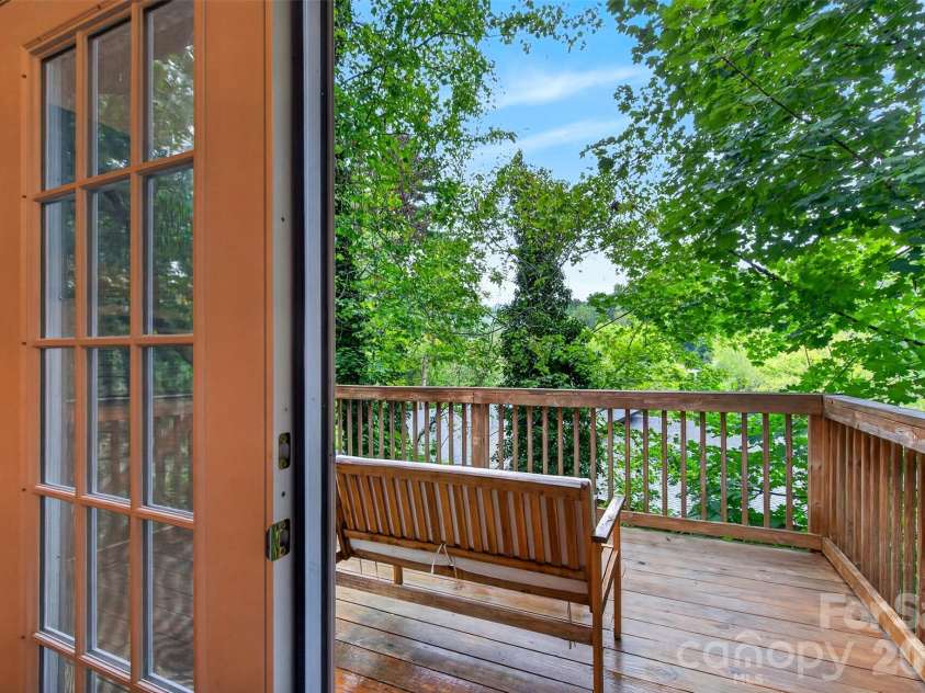 39 Spooks Branch Extension, Asheville, NC 28804.  MLS# CAR4425743, YatesRealty ID 53021. Deck off the dining space