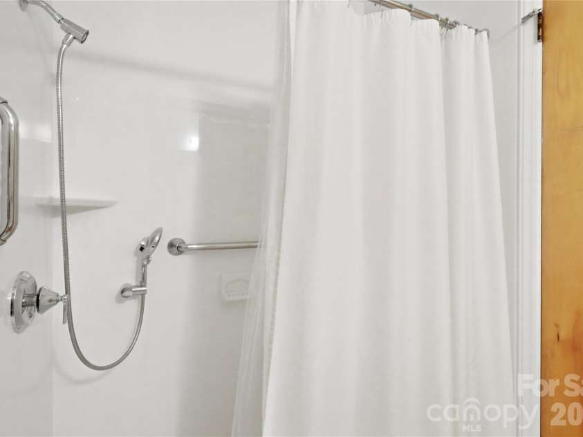 1745 Northbrook Drive, Charlotte, NC 28216.  MLS# CAR4428285, YatesRealty ID 53052. Hall bath features a walk-in shower