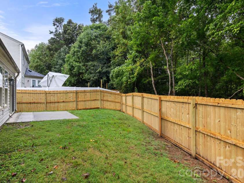 1940 Waters Trail Drive, Charlotte, NC 28216.  MLS# CAR4418345, YatesRealty ID 53063. Full Privacy Fence