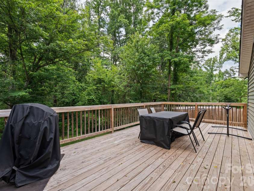 334 Mills Gap Road, Asheville, NC 28803.  MLS# CAR4322358, YatesRealty ID 5307. Back deck