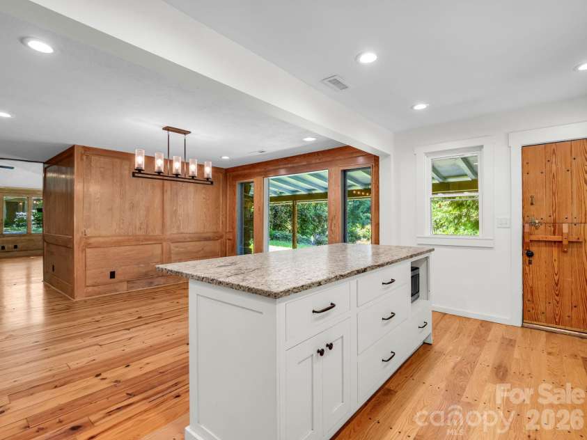 145 Stone Hedge Lane, Tryon, NC 28782.  MLS# CAR4428268, YatesRealty ID 53072. Breakfast bar with solid surface counter top