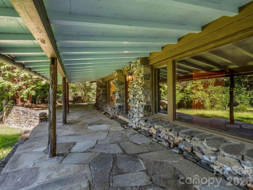 145 Stone Hedge Lane, Tryon, NC 28782.  MLS# CAR4428268, YatesRealty ID 53072. Covered front porch