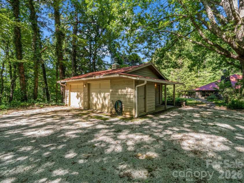 145 Stone Hedge Lane, Tryon, NC 28782.  MLS# CAR4428268, YatesRealty ID 53072. Detached two-car garage