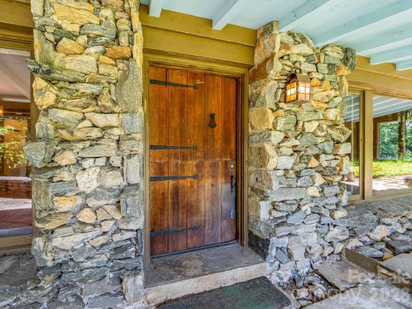 145 Stone Hedge Lane, Tryon, NC 28782.  MLS# CAR4428268, YatesRealty ID 53072. Front door