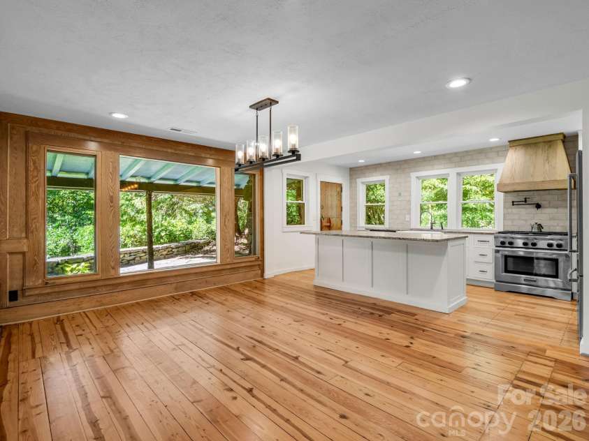 145 Stone Hedge Lane, Tryon, NC 28782.  MLS# CAR4428268, YatesRealty ID 53072. Open kitchen and dining area