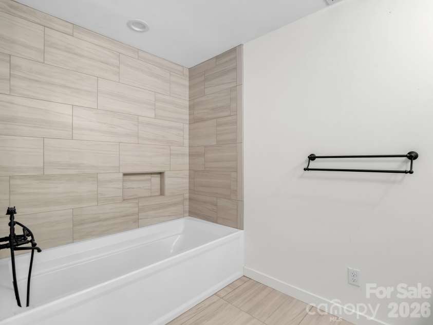 145 Stone Hedge Lane, Tryon, NC 28782.  MLS# CAR4428268, YatesRealty ID 53072. Primary tile bathroom