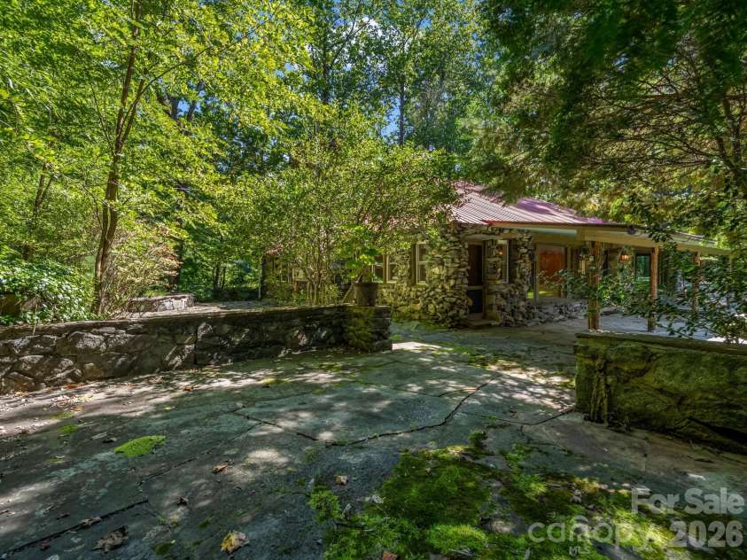 145 Stone Hedge Lane, Tryon, NC 28782.  MLS# CAR4428268, YatesRealty ID 53072. Stone patio perfect for grilling and dining